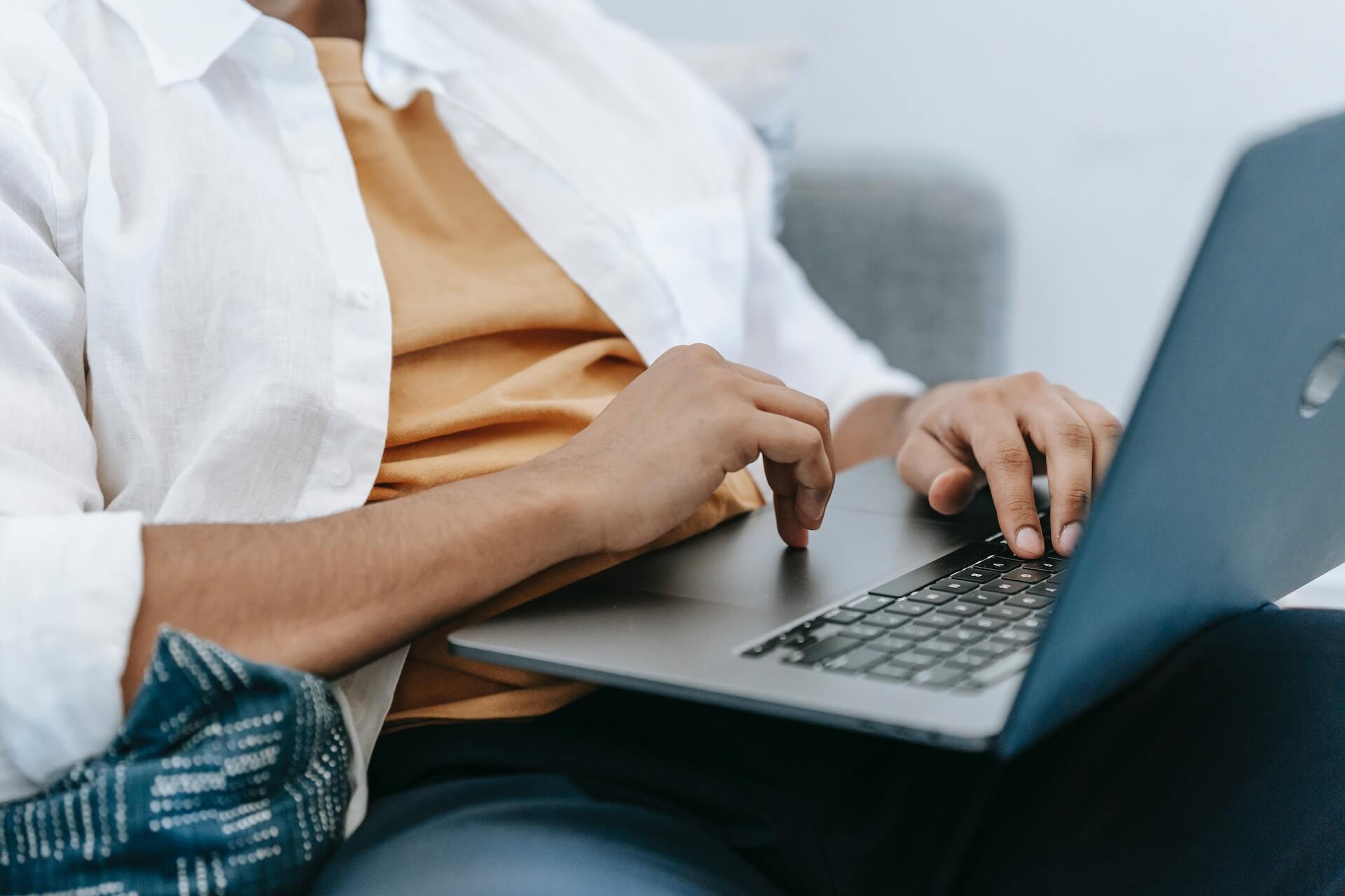 Someone applying for an IBV payday loan in Canada with his laptop